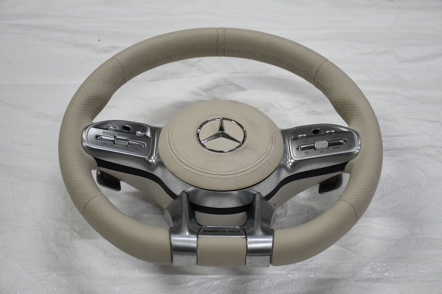 
                  
                    AMG Steering Wheel for Mercedes Beige, E class W212 2009-2015 , E Class W213 2017 , C Class W204 2009-14 , GLA 2014/19 , Cla 2014-19 , A Class 176 2014-19 , GLE W166 2015-18  W166 2015-18 , ML 2013-15 , GL 2013-15 , SLK ,W205 2015-18 , W222 2014-16
                  
                