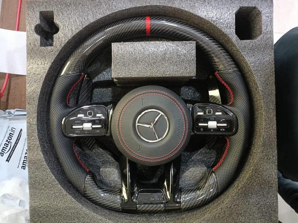 
                  
                    AMG Carbon Steering Wheel for Mercedes Black, E class W212 2009-2015 , E Class W213 2017 , C Class W204 2009-14 , GLA 2014/19 , Cla 2014-19 , A Class 176 2014-19 ,W166 2015-18 , W166 2015-18 , ML 2013-15 , GL 2013-15 , SLK , W205 2015-18 , W222 2014-16
                  
                