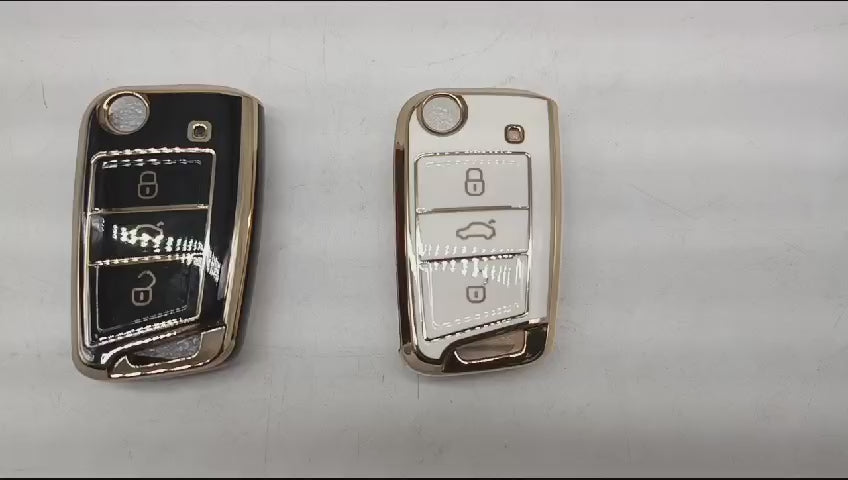 
                  
                    Load and play video in Gallery viewer, KMH - TPU Gold Car Key Cover Compatible with Volkswagen Polo Vento Jetta Ameo Virtus and Skoda Slavia Rapid Laura Superb Octavia Fabia Yeti Smart Key
                  
                