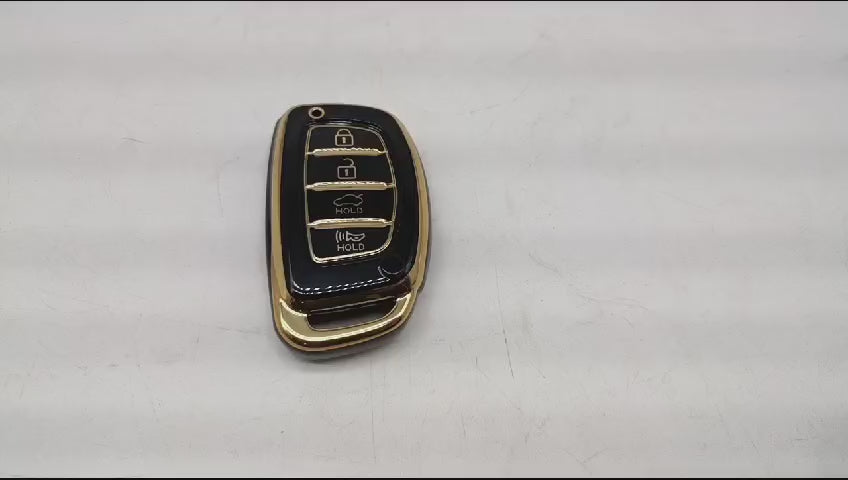 
                  
                    Load and play video in Gallery viewer, KMH - TPU Gold Car Key Cover Compatible with Hyundai Alcazar Creta 2022 Venue i20 Tucson Elantra 4 Button Smart Key Cover
                  
                