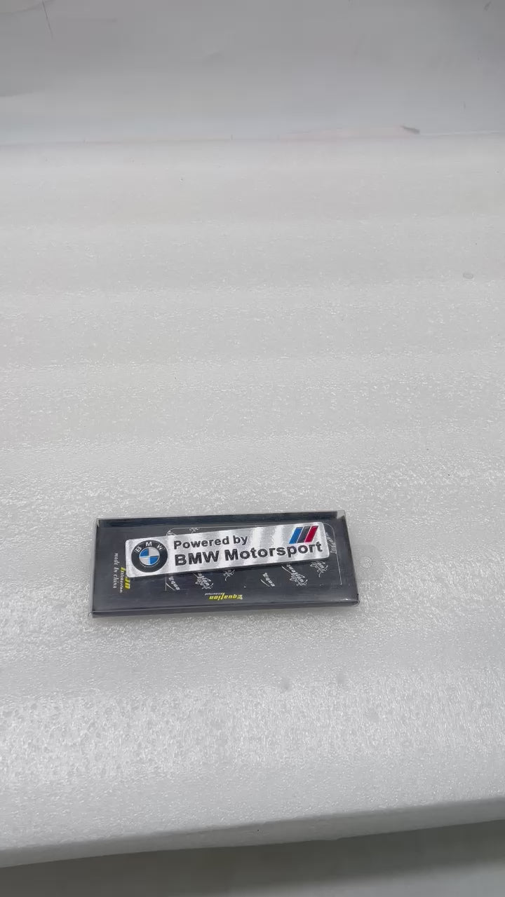 
                  
                    Load and play video in Gallery viewer, KMH Powered by BMW Motorsport Rectangular Badge with Chrome Effect
                  
                