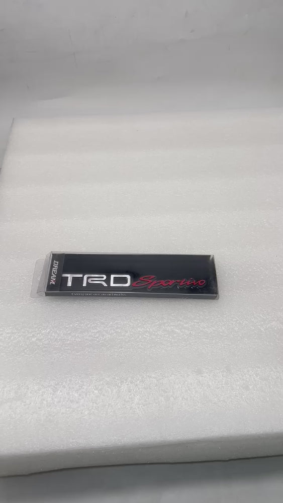 
                  
                    Load and play video in Gallery viewer, KMH TRD Sportivo Badge Black With Red
                  
                