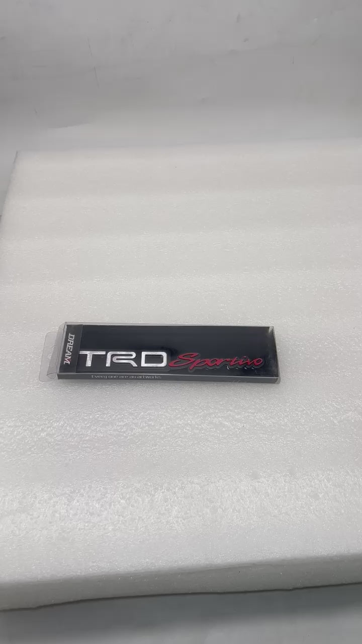 
                  
                    Load and play video in Gallery viewer, KMH TRD Sportivo Badge Black With Red
                  
                
